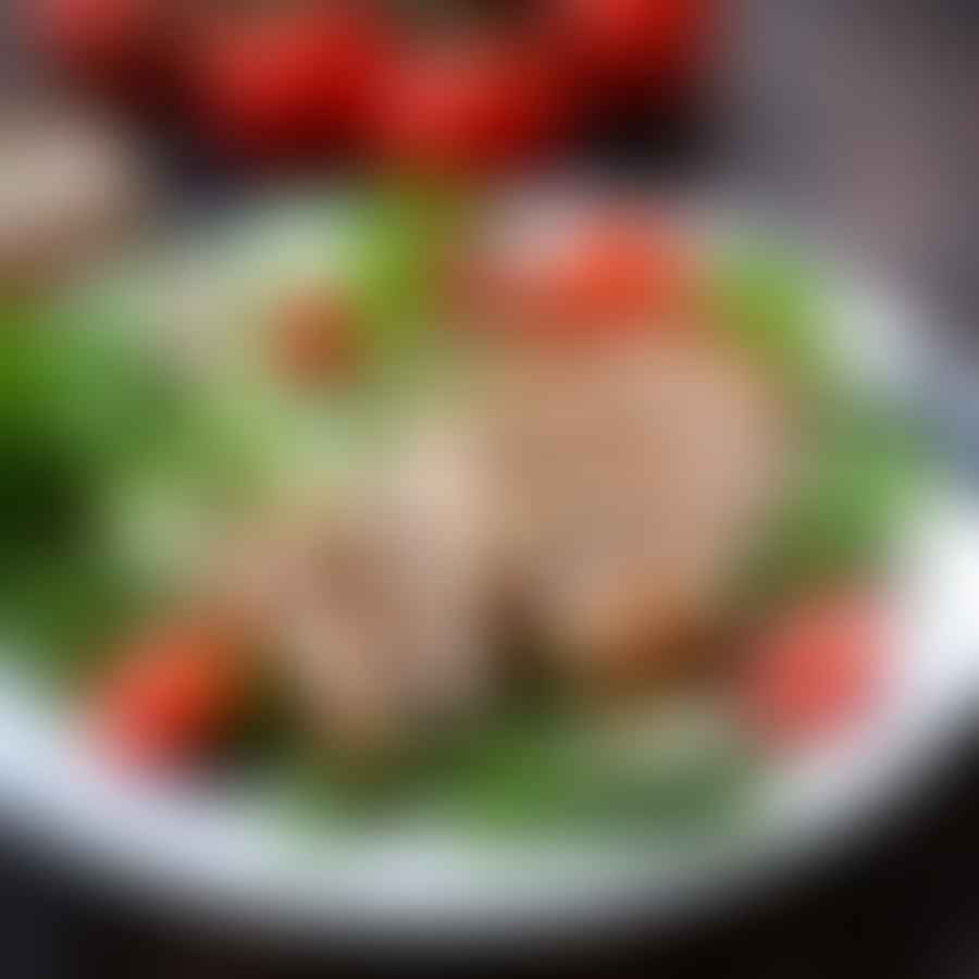 Grilled chicken salad sprinkled with paleo protein powder