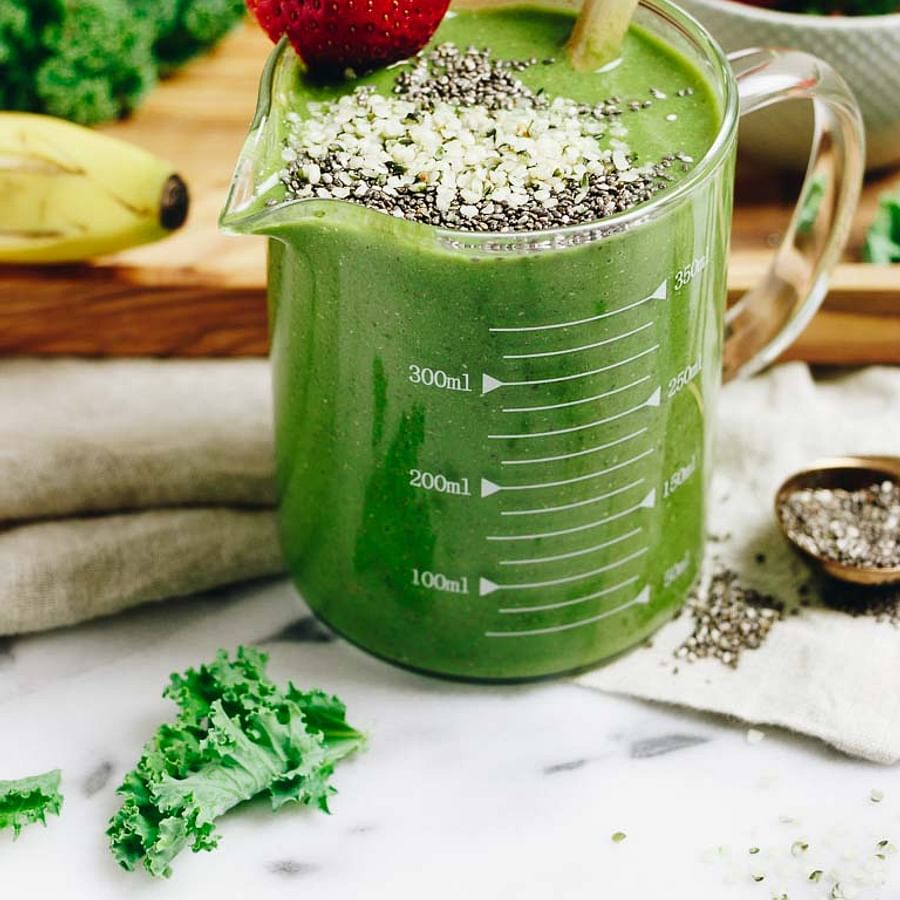 Refreshing Paleo Breakfast Smoothie in a glass with a straw